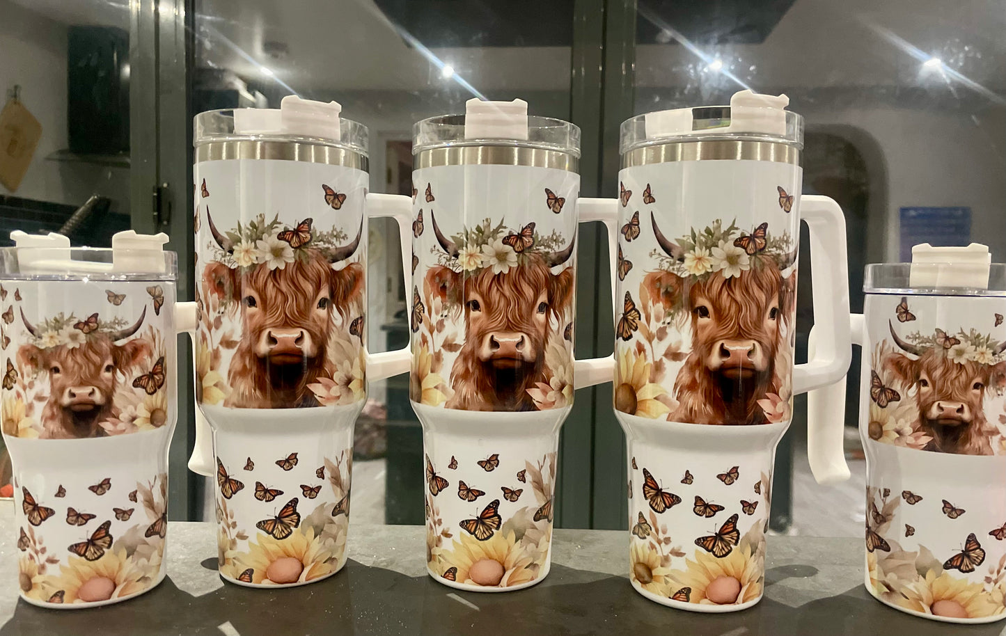 40oz Highland cow tumbler with lid and straw.