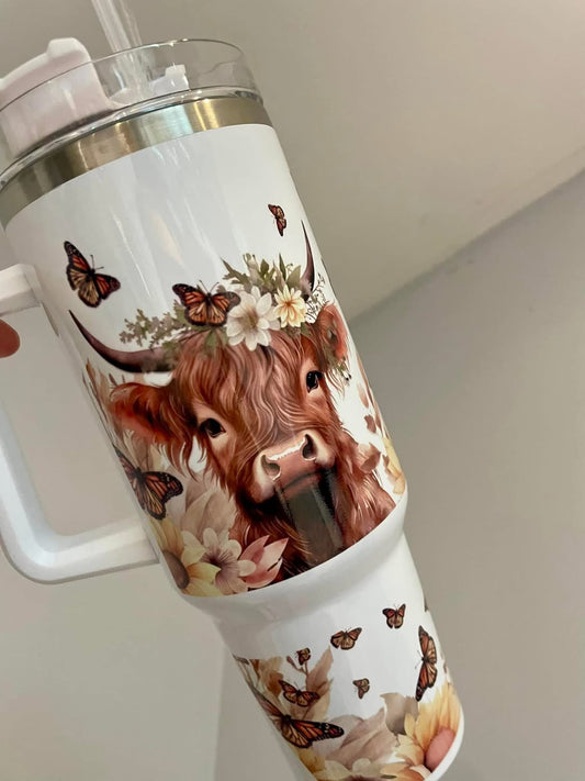 40oz Highland cow tumbler with lid and straw.